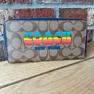 Coach Accordion Zip Wallet In Signature Canvas With Rainbow Coach Logo